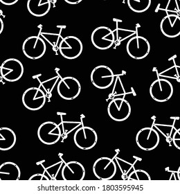 Mountain bikes seamless vector background. Bicycle pattern repeat white on black. Distressed grunge style. Monochrome hipster sport design for fabric, wrapping, sports wear, jersey, flyers.