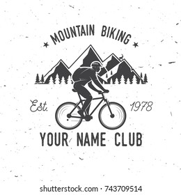 Mountain biking. Vector illustration. Concept for shirt or logo, print, stamp or tee. Vintage typography design with man riding bike and mountain silhouette.