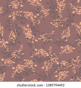 Mountain camouflage of various shades of beige, brown and dusty wine red colors. Colorful seamless pattern that can be used as a camo print for clothing and background and backdrop or wallpaper