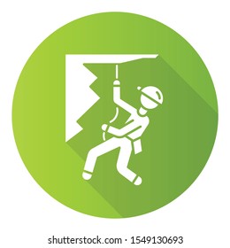 Mountain climbing green flat design long shadow glyph icon. Alpinism, mountaineering. Abseiling, rappelling descend. Caving, spelunking. Mountaineer sliding down rope. Vector silhouette illustration