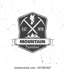 Mountain expedition badge. Vector illustration. Concept for shirt or logo, print, stamp or tee. Vintage typography design with ice axe, mountaineer and mountain silhouette. Outdoors adventure emblem.