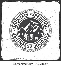 Mountain expedition badge. Vector illustration. Concept for shirt or logo, print, stamp or tee. Vintage typography design with mountaineers and mountain silhouette. Outdoors adventure emblem.