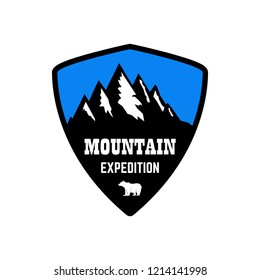 Mountain expedition. Emblem template with rock peak. Design element for logo, label, emblem, sign, poster. Vector illustration