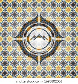 mountain icon inside arabic style badge. Arabesque decoration.