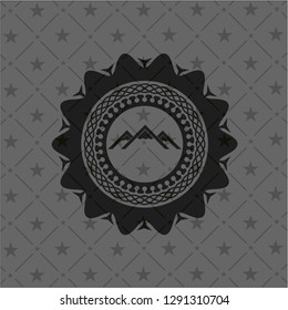 mountain icon inside black badge