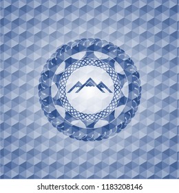 mountain icon inside blue emblem or badge with abstract geometric polygonal pattern background.