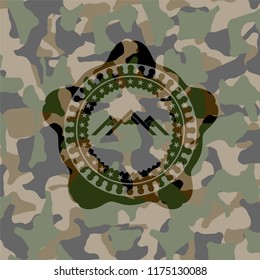 mountain icon inside camouflage texture
