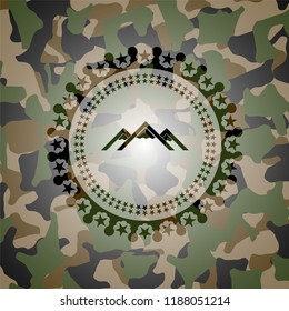 mountain icon inside camouflaged emblem