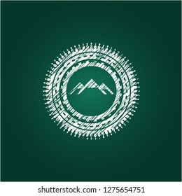 mountain icon inside chalk emblem