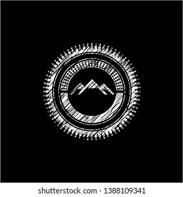 mountain icon inside chalk emblem
