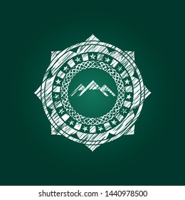 mountain icon inside chalk emblem