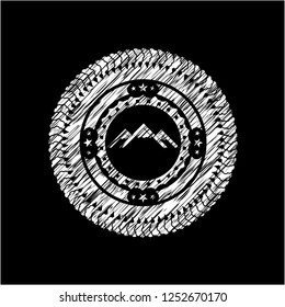 mountain icon inside chalkboard emblem