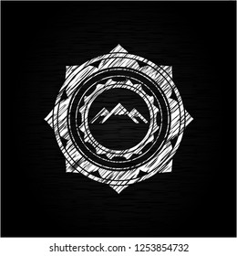mountain icon inside chalkboard emblem