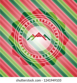 mountain icon inside christmas colors style emblem.