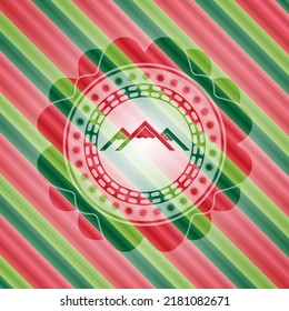 mountain icon inside christmas colors style badge. 