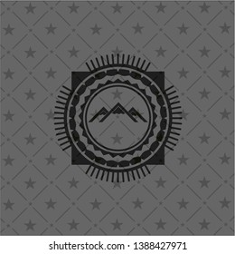 mountain icon inside dark badge