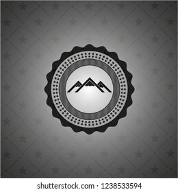 mountain icon inside dark emblem