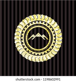 mountain icon inside gold badge