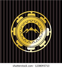 mountain icon inside gold badge or emblem