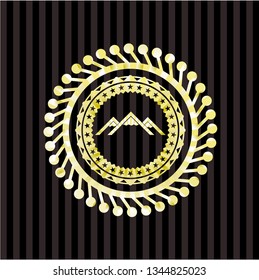 mountain icon inside gold badge
