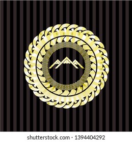 mountain icon inside gold badge or emblem