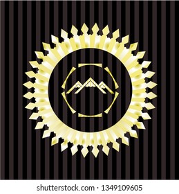 mountain icon inside gold emblem