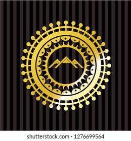 mountain icon inside golden emblem