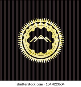 mountain icon inside golden emblem or badge