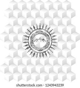 mountain icon inside grey badge with geometric cube white background