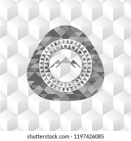 mountain icon inside grey emblem with cube white background