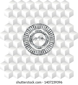 mountain icon inside grey emblem with geometric cube white background