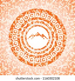 mountain icon inside orange mosaic emblem