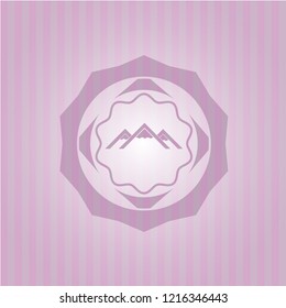 mountain icon inside pink emblem