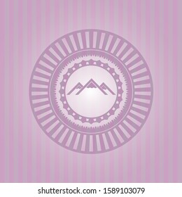 mountain icon inside pink emblem