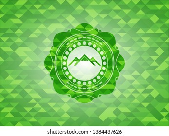 mountain icon inside realistic green mosaic emblem