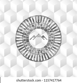 mountain icon inside realistic grey emblem with geometric cube white background