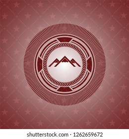 mountain icon inside red icon or emblem