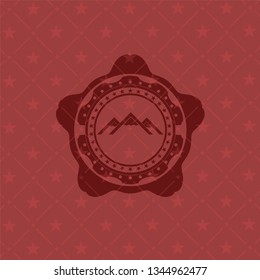 mountain icon inside red icon or emblem