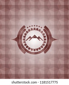 mountain icon inside red seamless emblem or badge with geometric pattern background.
