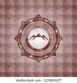 mountain icon inside red seamless badge with geometric pattern background.