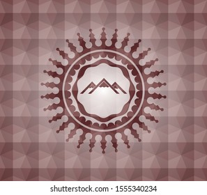 mountain icon inside red seamless emblem or badge with geometric pattern background.