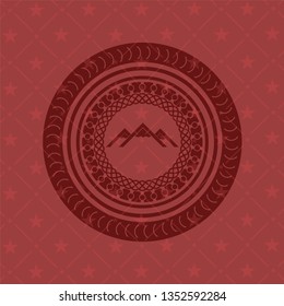 mountain icon inside retro red emblem