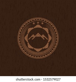 mountain icon inside retro wood emblem