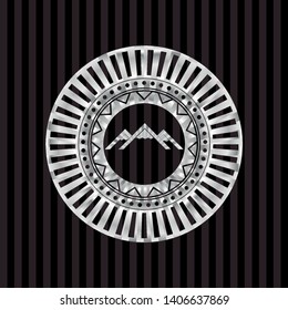 mountain icon inside silver badge
