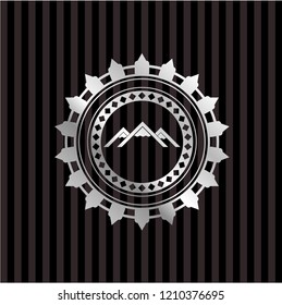 mountain icon inside silver emblem