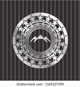 mountain icon inside silvery shiny emblem