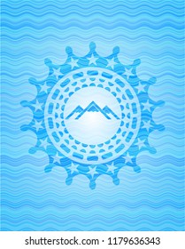 mountain icon inside sky blue water wave badge background.