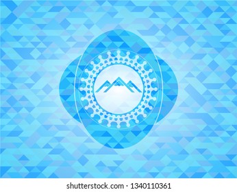 mountain icon inside sky blue emblem with mosaic ecological style background