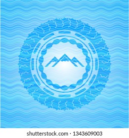 mountain icon inside sky blue water wave emblem background.