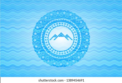 mountain icon inside water concept style badge.